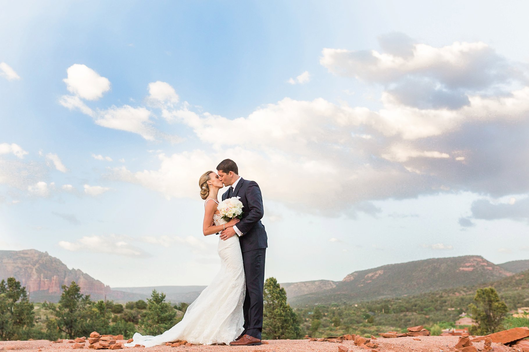 Bride and Groom kissing with Sedona backdrop 